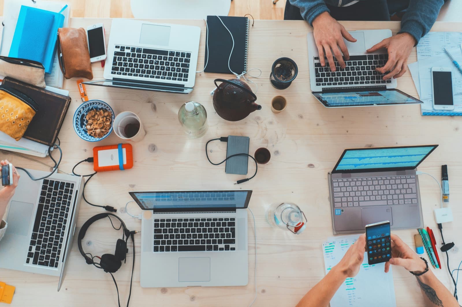 Loopworks team working across devices during a build sprint